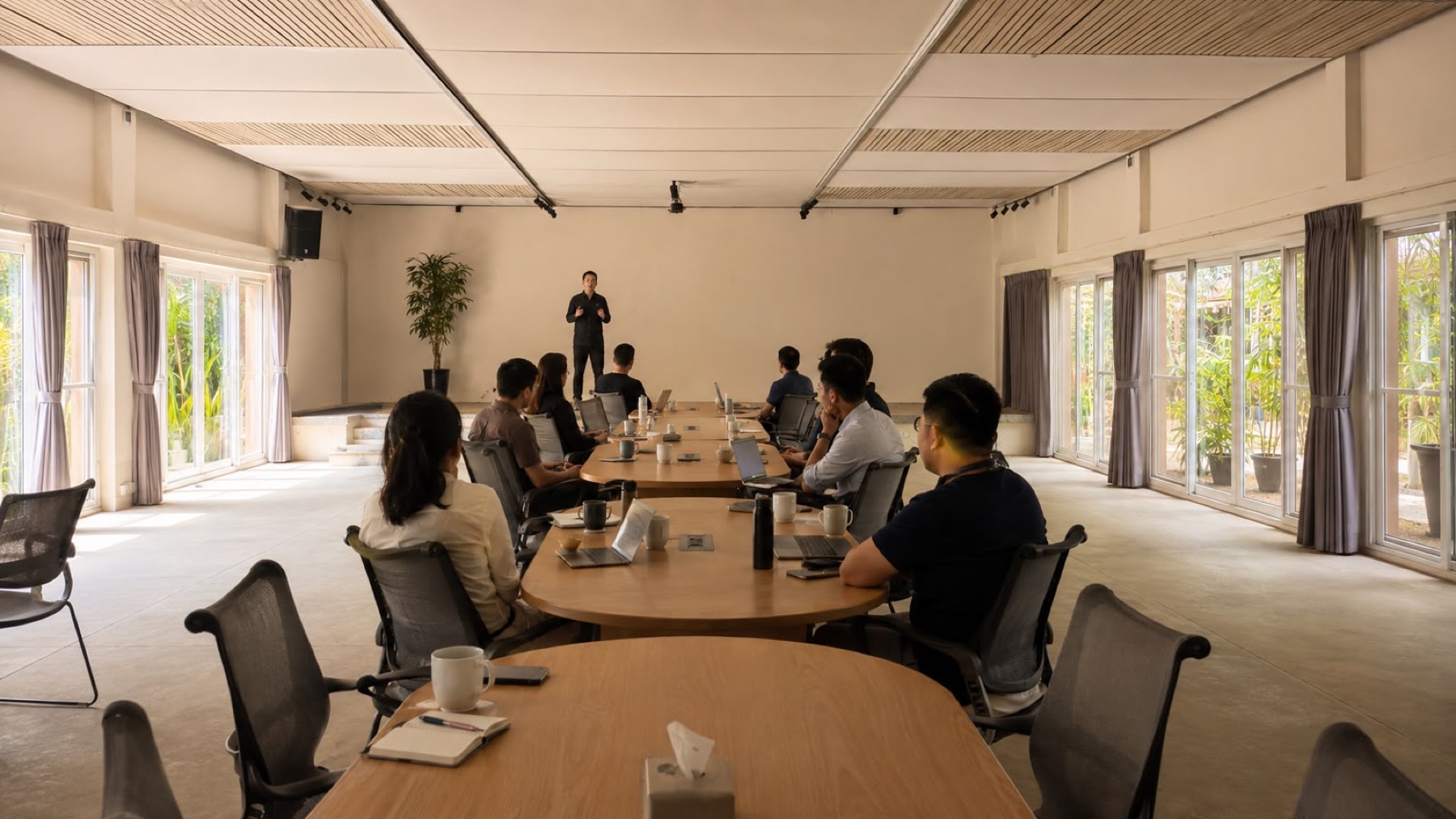 A team in a working session in the hall at Orchid Tree