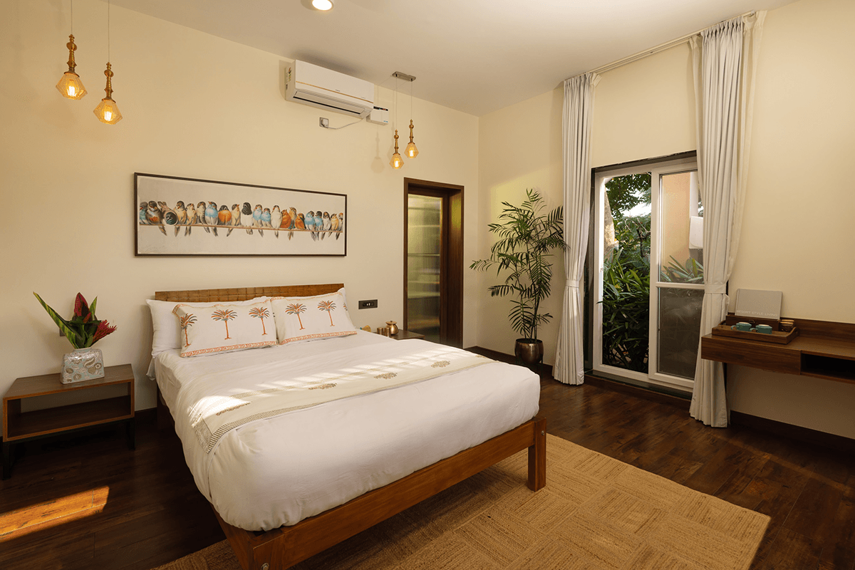 A sun-lit Couple Room by the pool at Orchid Tree, with a skylight bath