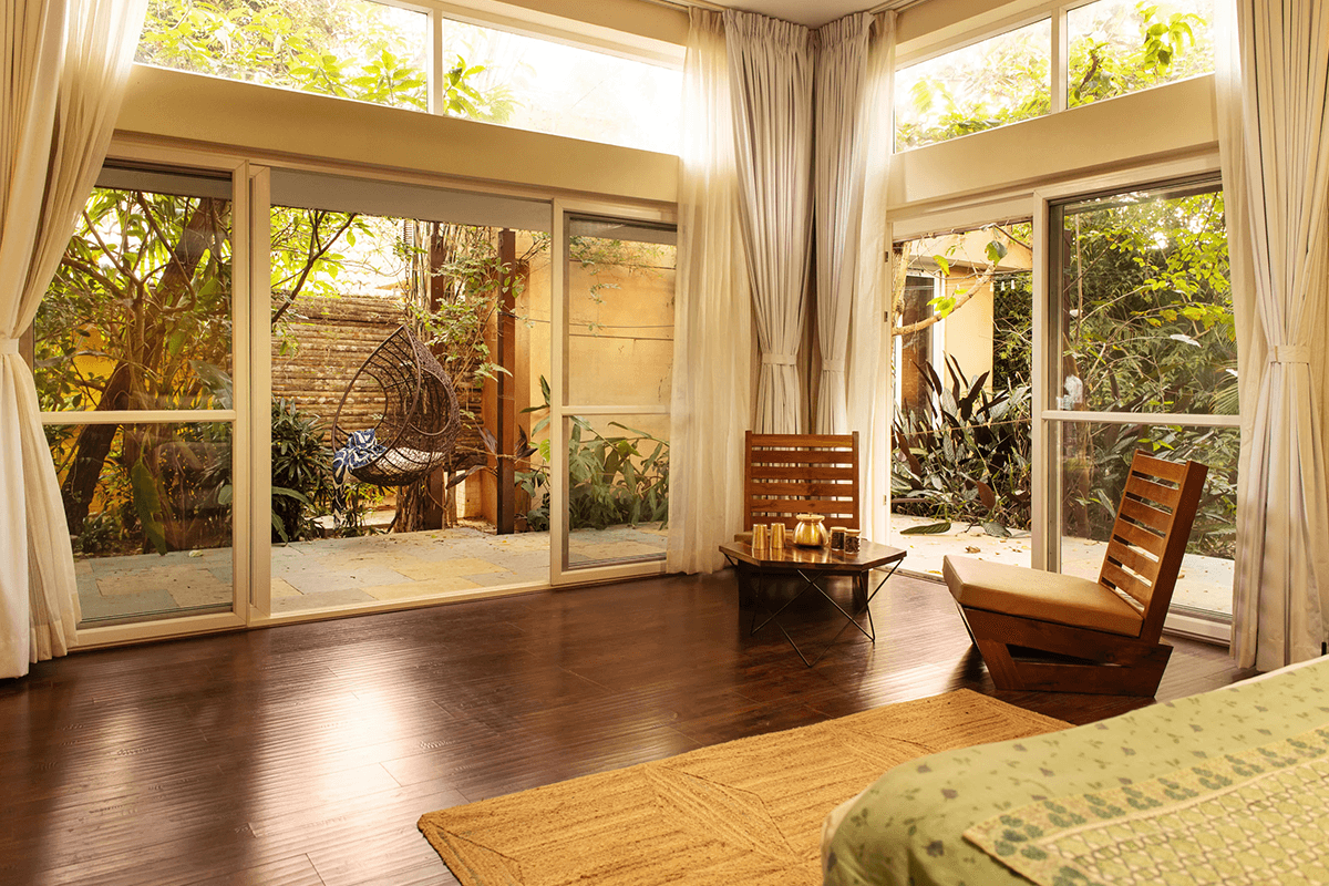 A Family Room by the pool at Orchid Tree, with pull-out bedding and pool views